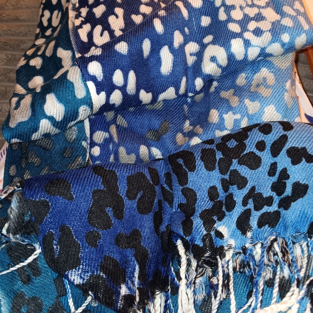 VERY SOFT AND COZY. FEELS LIKE CASHMERE  SCARF.